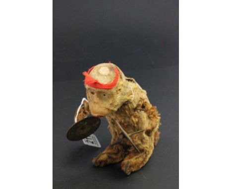 Vintage clockwork symbol playing monkey possibly Schuco