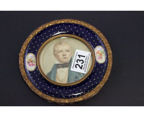 Enamelled ceramic and gilt metal frame with miniature to centre