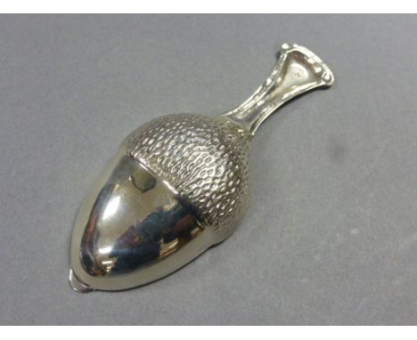 Silver caddy spoon in the form of an acorn