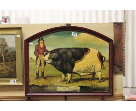 A reproduction print of a "Caesar" championship winning pig, on a wooden plaque 