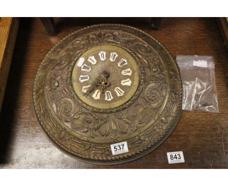 Heavily embossed brass clock with key