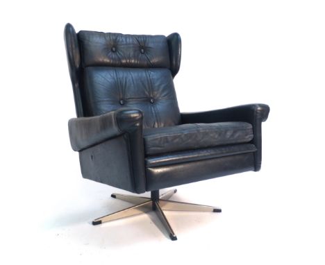 A Skippers Mobler black leather and button upholstered wingback armchair on an aluminium five star base   CONDITION REPORT:  