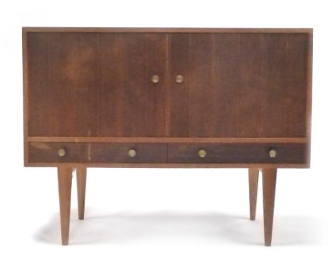 A 1960's teak sideboard with two doors over a single drawer on tapering legs by Gordon Russell of Broadway, l. 121 cm   CONDI