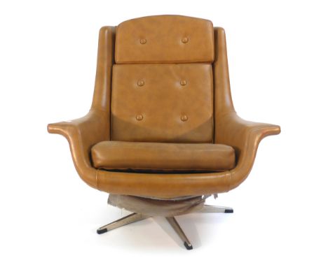 A 1970's mustard and button upholstered lounge armchair on an aluminium five star base   CONDITION REPORT:  Wear commensurate