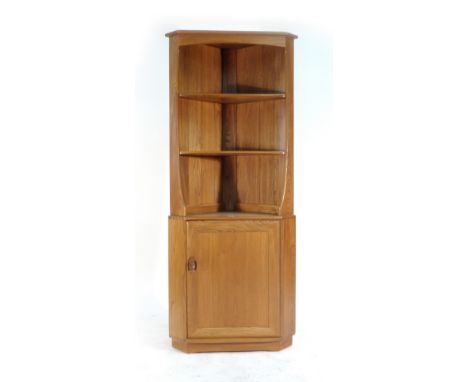 An Ercol elm corner cabinet, the open gallery over a single door, w. 81 cm   CONDITION REPORT:  Good - structurally sound, no