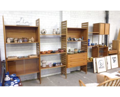 A Stapples 'Ladderax' teak modular shelving system including four teak full-height uprights, two metal full-height uprights, 