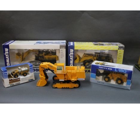 A group of boxed and unboxed diecast scale models of construction vehicles, to include three Joal 1:50 scale models, an Ertl 