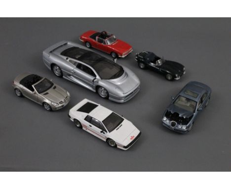 A group of six large scale diecast model cars, to comprise Maisto, Auto Art, and Jadi