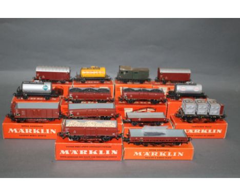 A group of fourteen Marklin HO scale wagons and rolling stock, to comprise Esso Shell wagons, Goods wagons, Beer wagons and o