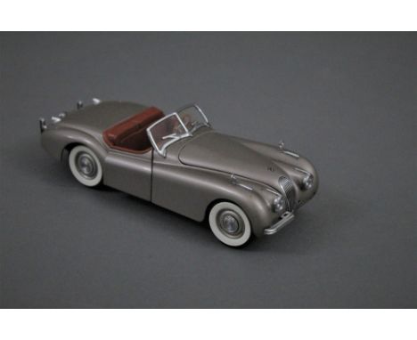 A Danbury Mint scale model of a 1949 Jaguar XK120 