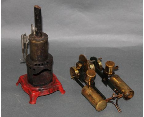 A small German made vertical stationary engine, measuring 22 cm tall, and sold together with a twin cylinder stationary engin