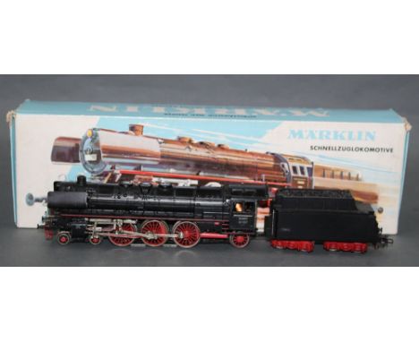 A Marklin HO scale 4-6-2 express steam locomotive and tender (3048), retaining its original cardboard box 