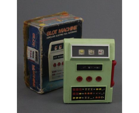 A 1970s Japanese Waco hand held cordless electric slot machine, keeping its original box