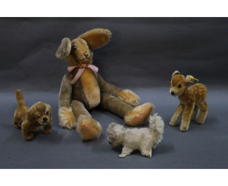 A 1960's Steiff Lulac floppy rabbit, measuring 43 cm tall, and sold together with three 1950's-70's Steiff animals, to compri