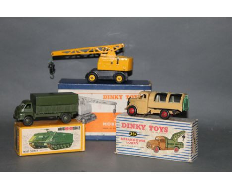 A Dinky 3 ton army wagon (621), displayed within an Airfix HO scale troop carrier box, a Dinky Bedford refuse wagon (252) dis