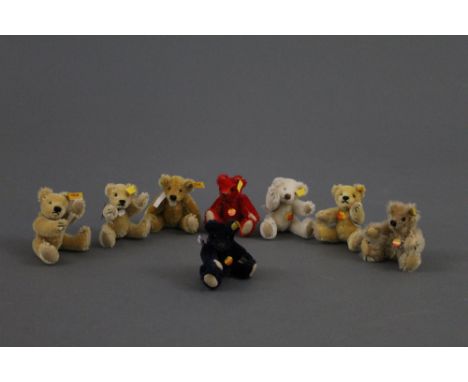 A group of eight Steiff Original miniature teddy bears, of varying colours, all keeping their circular chest tags, the talles