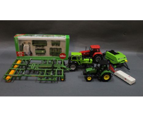 A group of Siku diecast scale models, to comprise three tractors, a 1:32 scale 'Accessories Set for Front Loader', and an 'Am