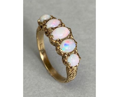 9ct Gold ring set with five graduated Opals in ornate settings size 'N'