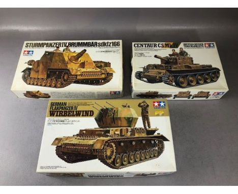 Three TAMIYA unassembled 1:35 scale model tanks: Sturmpanzer, Flakpanzer Wirbelwind, Centaur