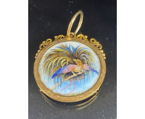 15ct Gold mount containing a silver 2 New Guinea Mark coin dated 1894 and decorated with enamel and a hand painted Bird of Pa