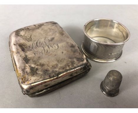 Silver items to include cigarette case (A/F) thimble and a napkin ring (80g)