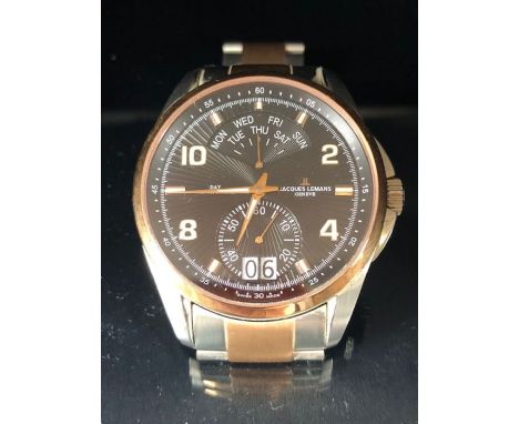 Wristwatch by JACQUES LEMANS in original box with instruction manual model number G-171C with date, day and seconds aperture 
