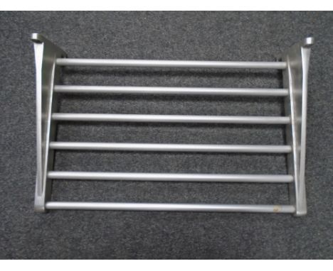 A stainless steel wall shelf.