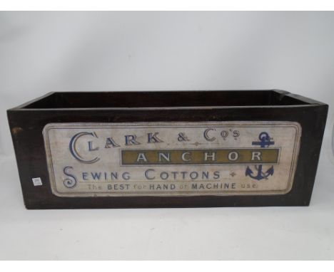 A wooden trough with Clark &amp; Co. sewing cottons advertising (width 44.5cm).