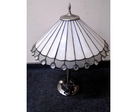 A contemporary chrome metal table lamp with leaded glass shade 