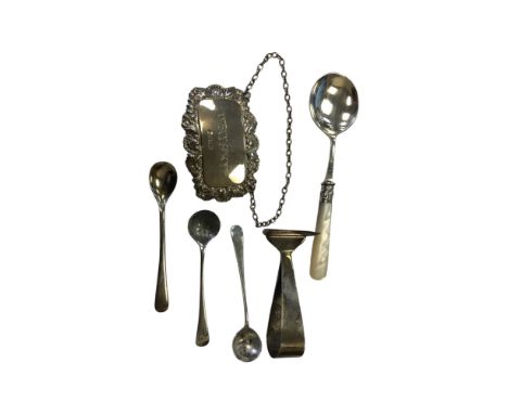 A silver whisky decanter label, three caddy spoons and two further items of cutlery. (8)