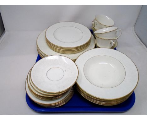 A quantity of Royal Worcester Concerto gilded tea and dinner ware, dinner plates 10.5 inches in diameter