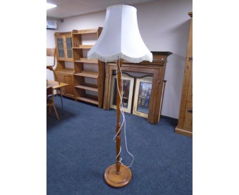 A beech standard lamp with shade 
