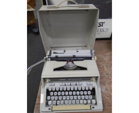 A Hermes 3000 manual typewriter in case.