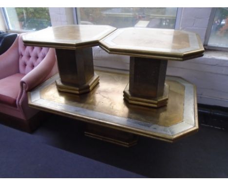 A Danish brass octagonal pedestal coffee table together with a pair of matching lamp tables.