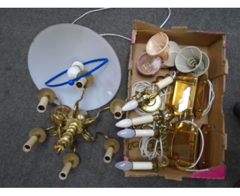 A box containing continental brass light fittings, wall light shades and a 1970's glass hanging light shade.