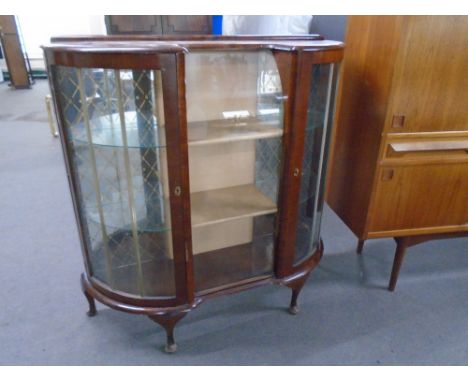 A 1930s walnut Art Deco display cabinet.