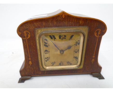 A 19th century French inlaid mahogany Art Nouveau desk clock.