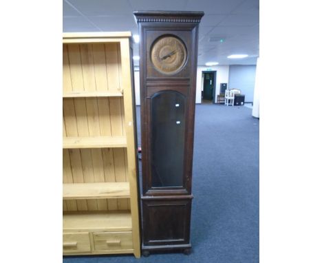 An oak longcase clock with metal dial.