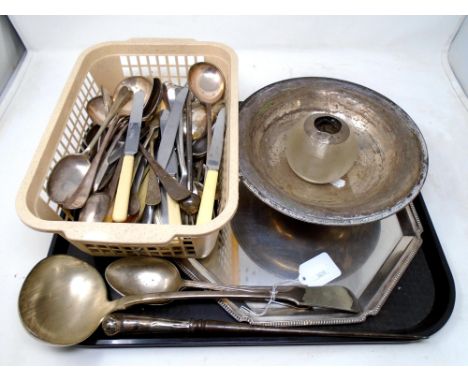 A tray of silver plated cutlery, a large ladle, a glass match striker with silver mount etc.