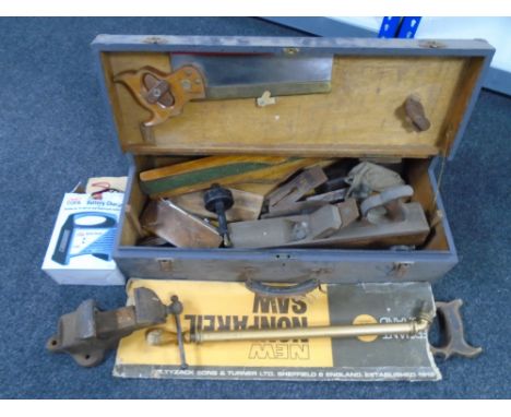 An antique wooden tool box together with metal vice, battery charger, metal sprayer, wood working tools etc 