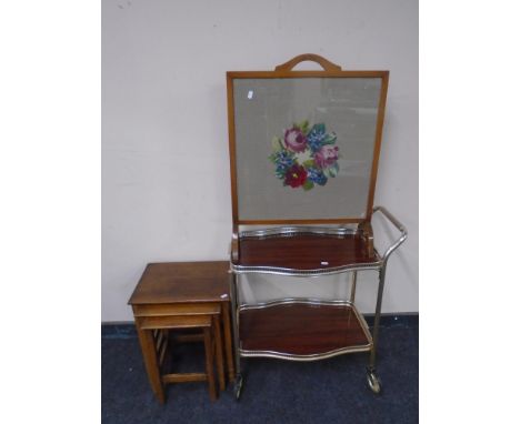 A two-tier tea trolley, nest of three tables and tapestry fire screen 