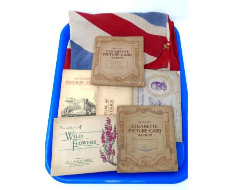A tray containing Will's cigarette card albums including railway engines, film stars, royalty together with a folded British 