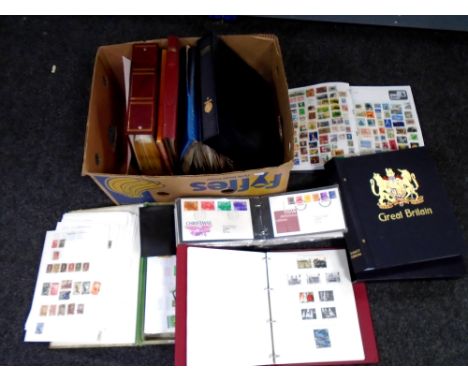A box containing First Day Covers, albums of stamps, Stanley Gibbons albums etc.