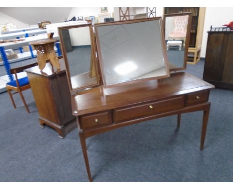 A Stag Minstrel three drawer dressing table with triple mirror