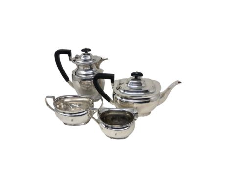 A George V silver three-piece tea service, Henry Atkin, Sheffield 1918-1920, comprising teapot with ebony handles, sugar bowl