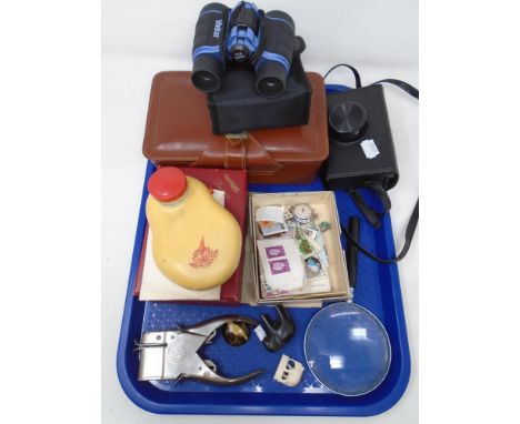 A tray of stamps, magnifying glass, field binoculars, Kodak camera etc 