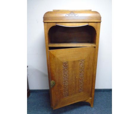 A continental carved oak Art Deco cabinet.
