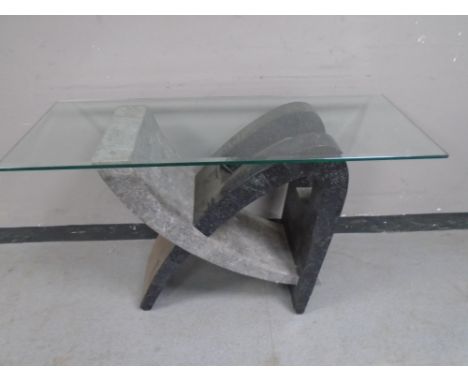 A contemporary glass topped console table on faux marble base (Af)