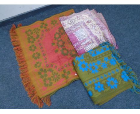 A box containing three assorted woolen rugs and throws together with three 20th century light shades.