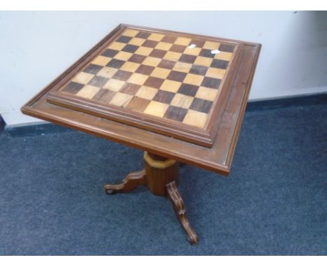 A chess board pedestal occasional table 